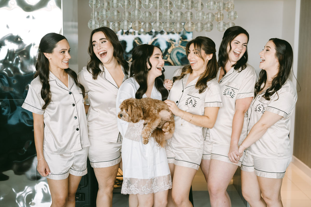 bridesmaids in pink pajamas getting ready at W Hotel wedding