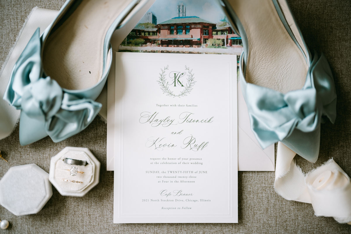 blue wedding shoes and invitation lay flat photo
