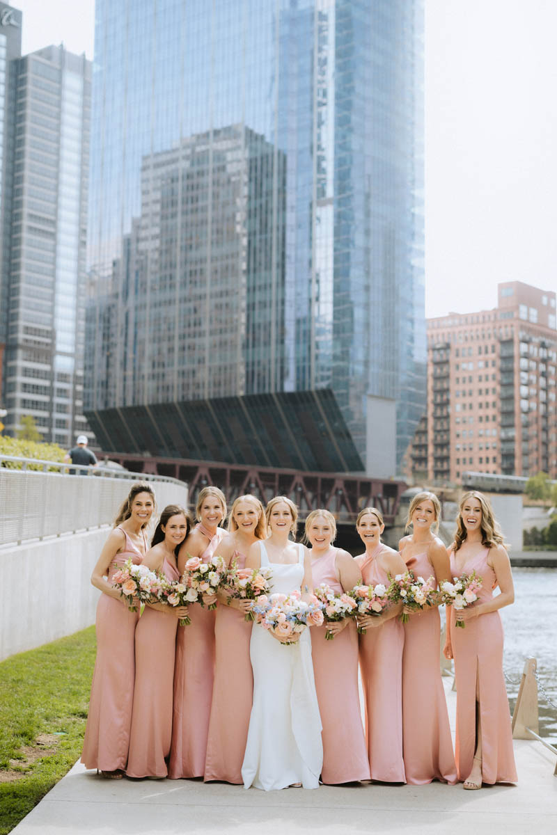 Bridesmaids in pink on the Chicago Riverwalk jetty