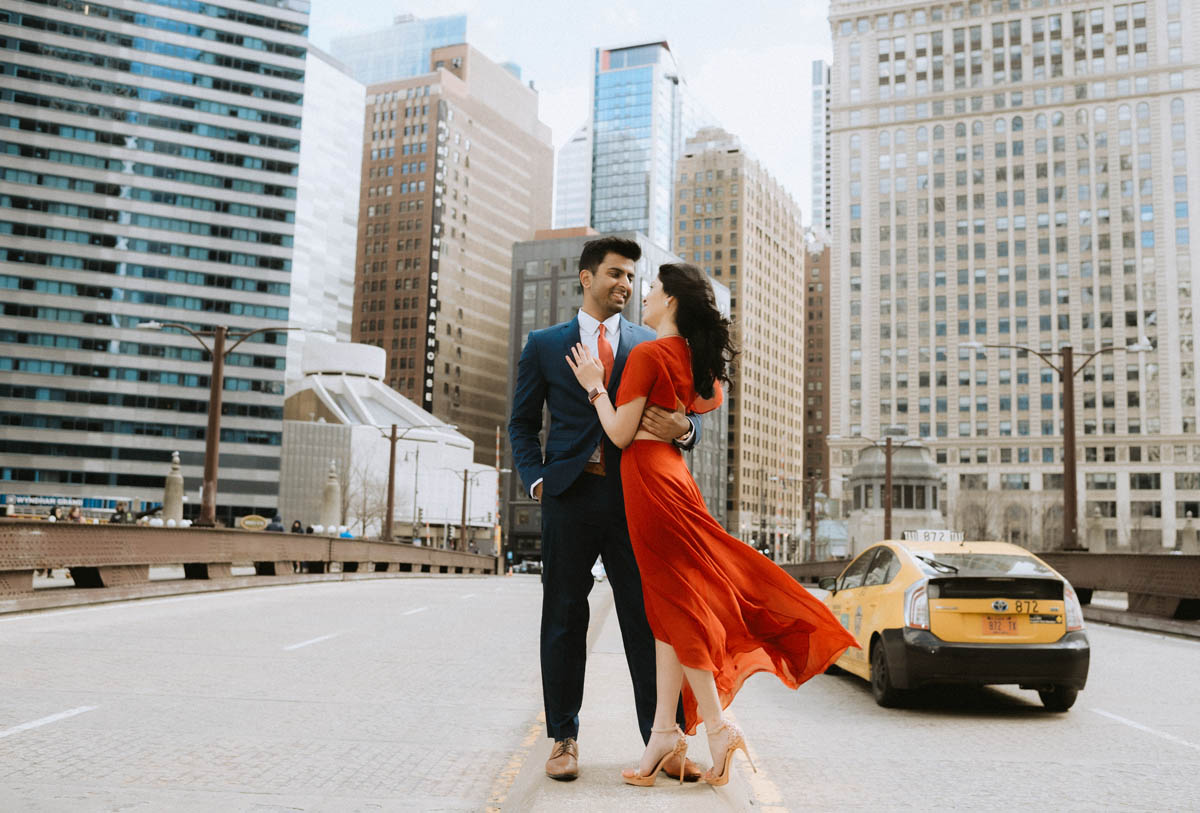 Engagement shoot on Wabash Street wearing bright red dress