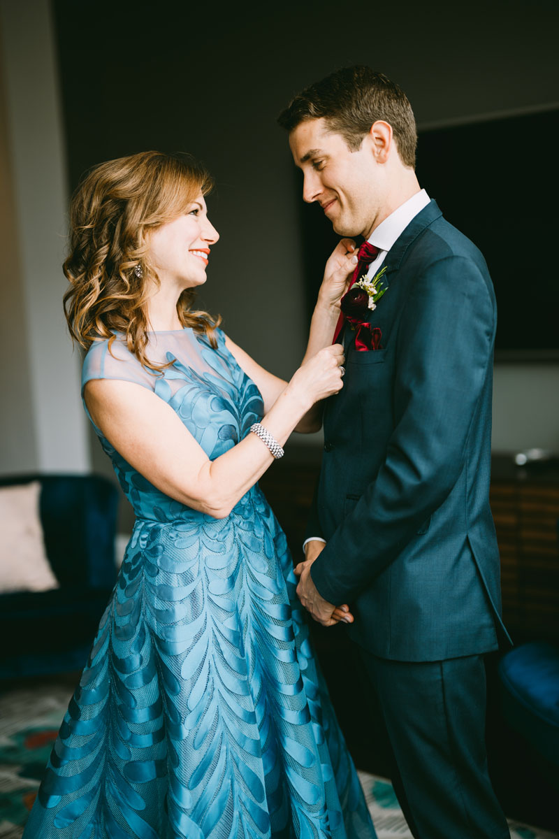 mom and groom getting ready