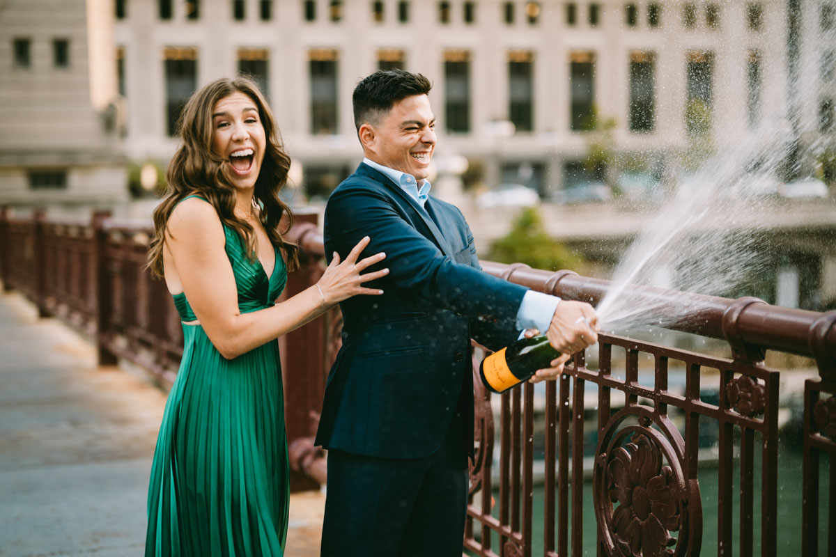 Chicago riverwalk engagement light and bright photographer champagne pop