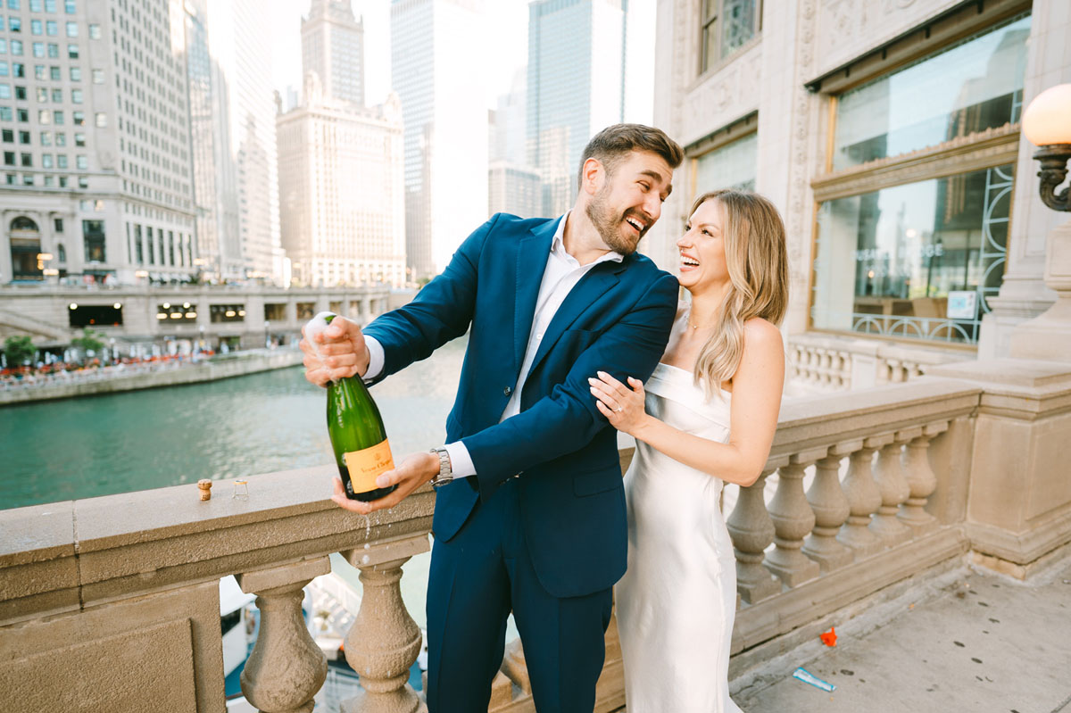 summer wrigley building engagement light and bright photography champagne pop