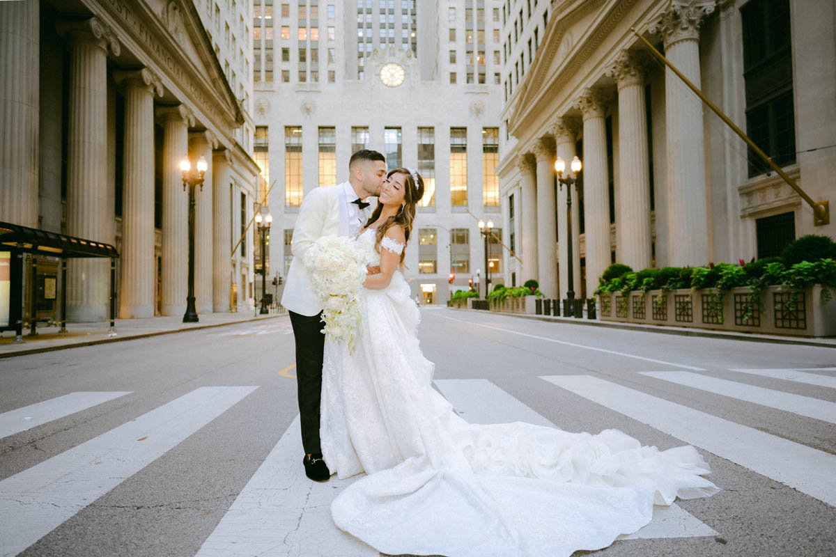 Bride and groom embrace for wedding portraits