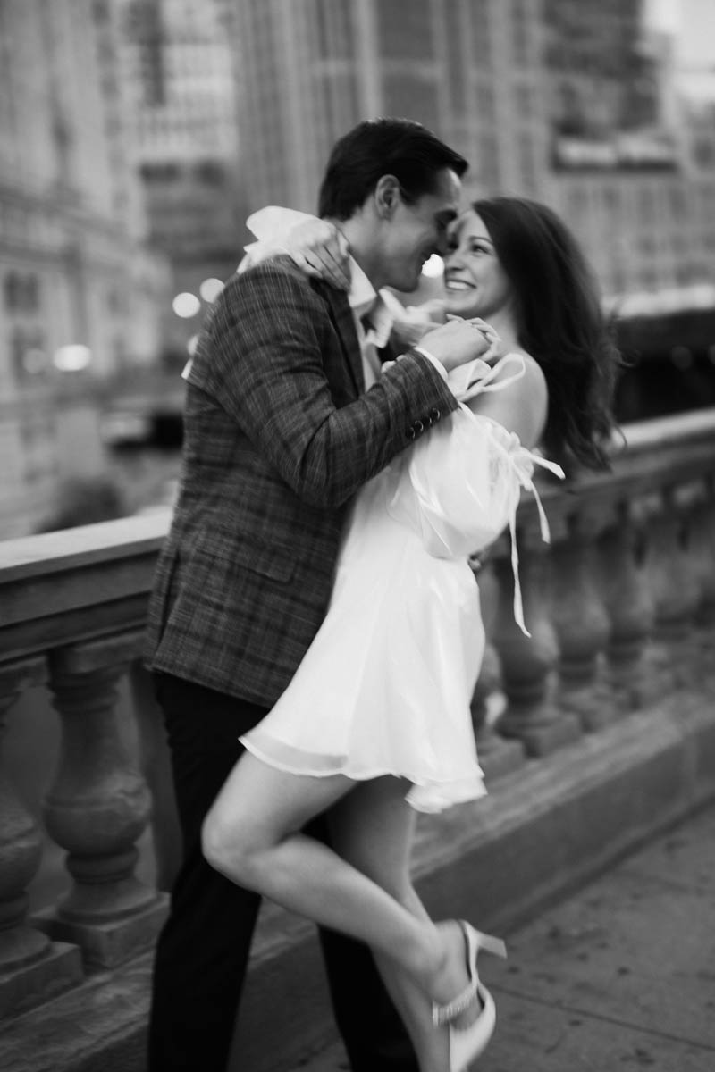 Dark and moody black and white Wrigley Building engagement photography