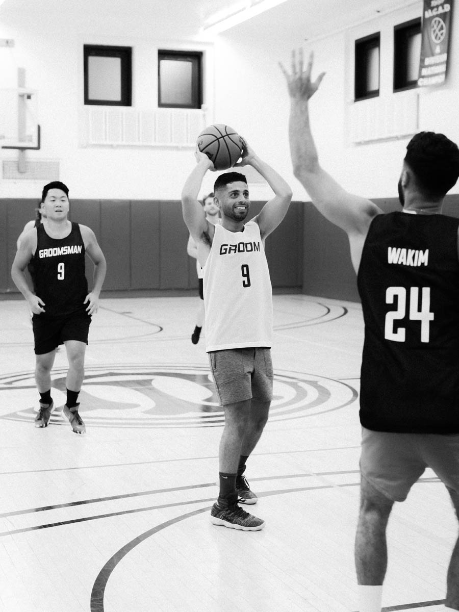 Groom playing basketball with his groomsmen