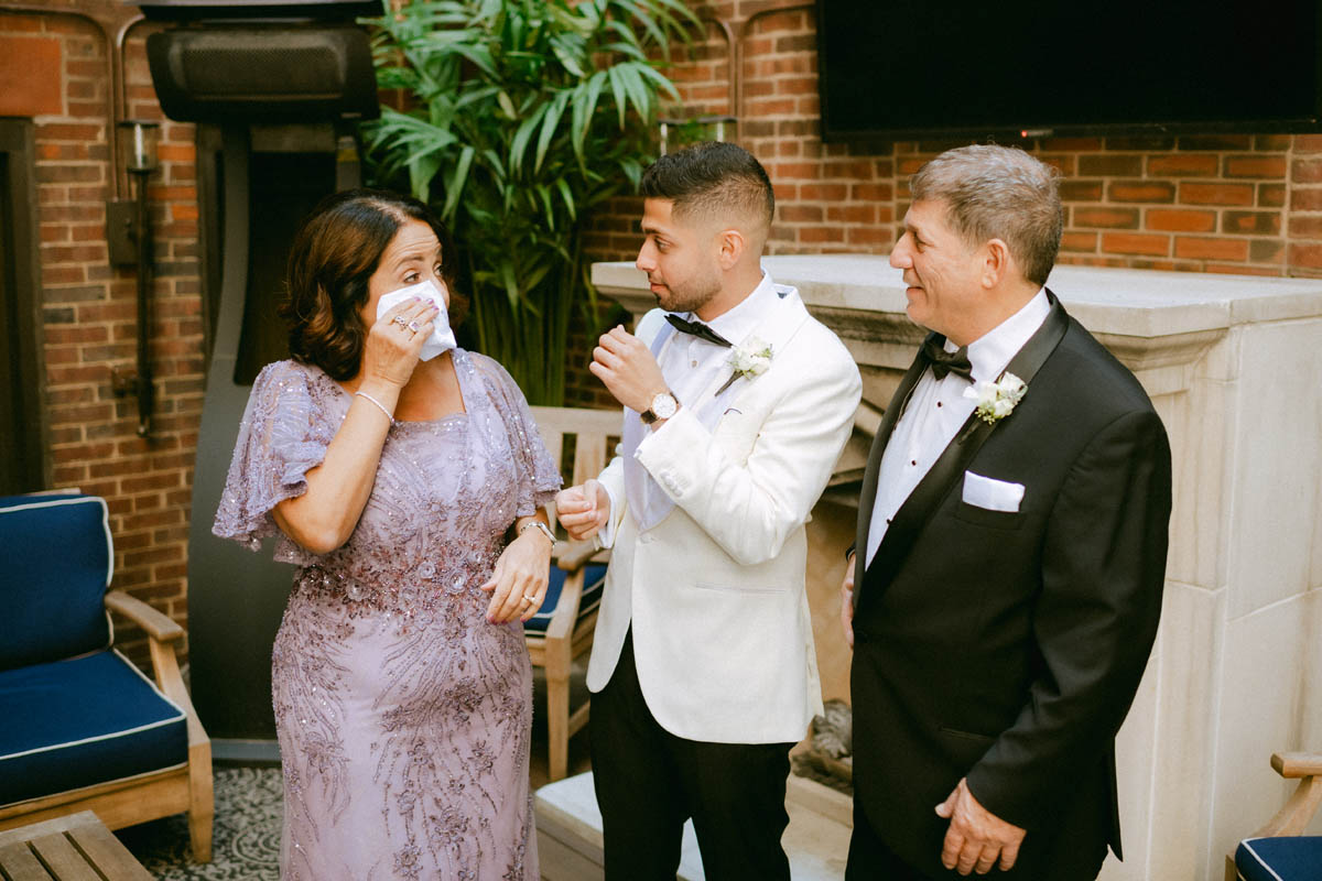 Groom's mom wipes away a tear
