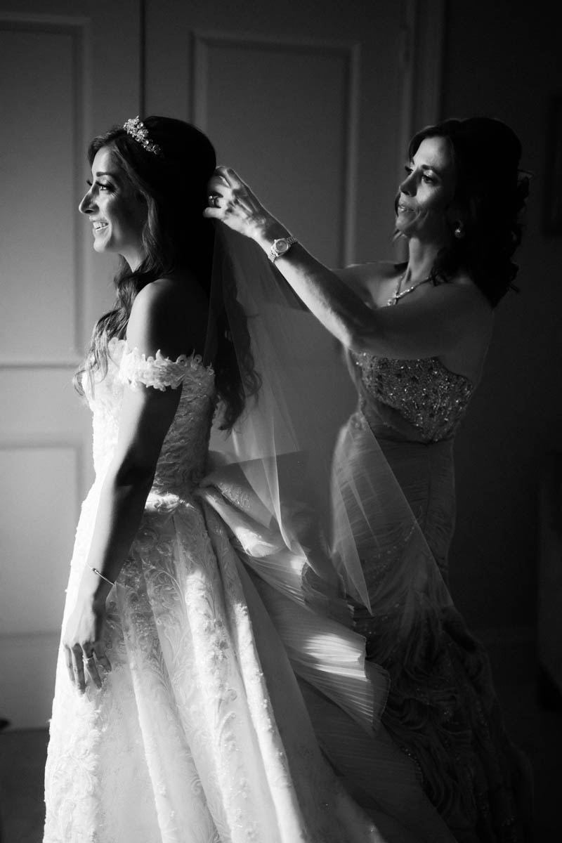 Bride and mom getting ready for Greek wedding