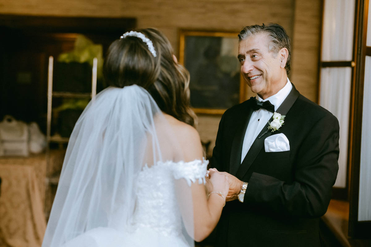 Bride and father sharing a moment during the wedding day
