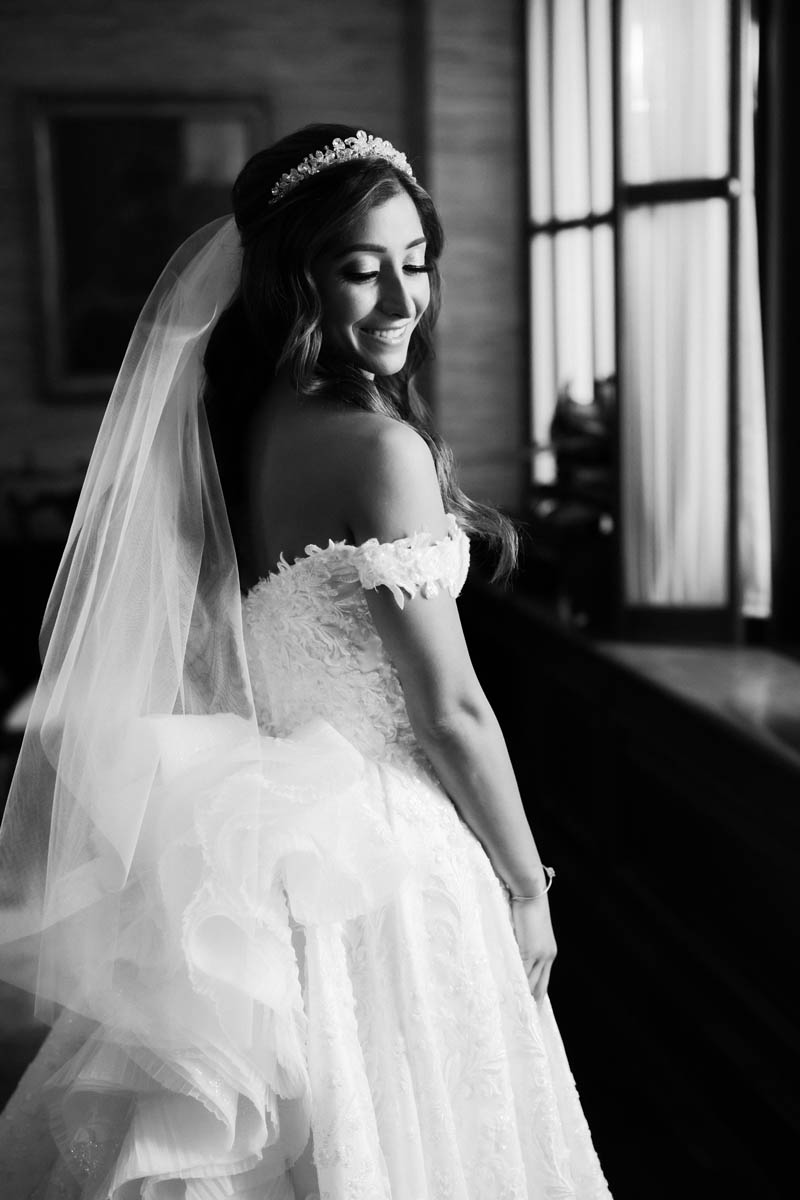 Black and white portrait of bride in her wedding dress