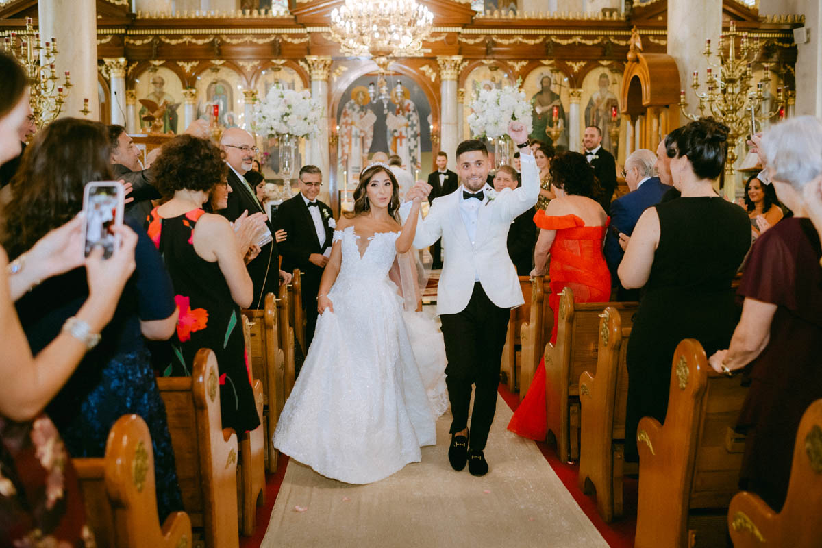 Bride and groom ceremony exit at Annunciation Greek Orthodox Cathedral