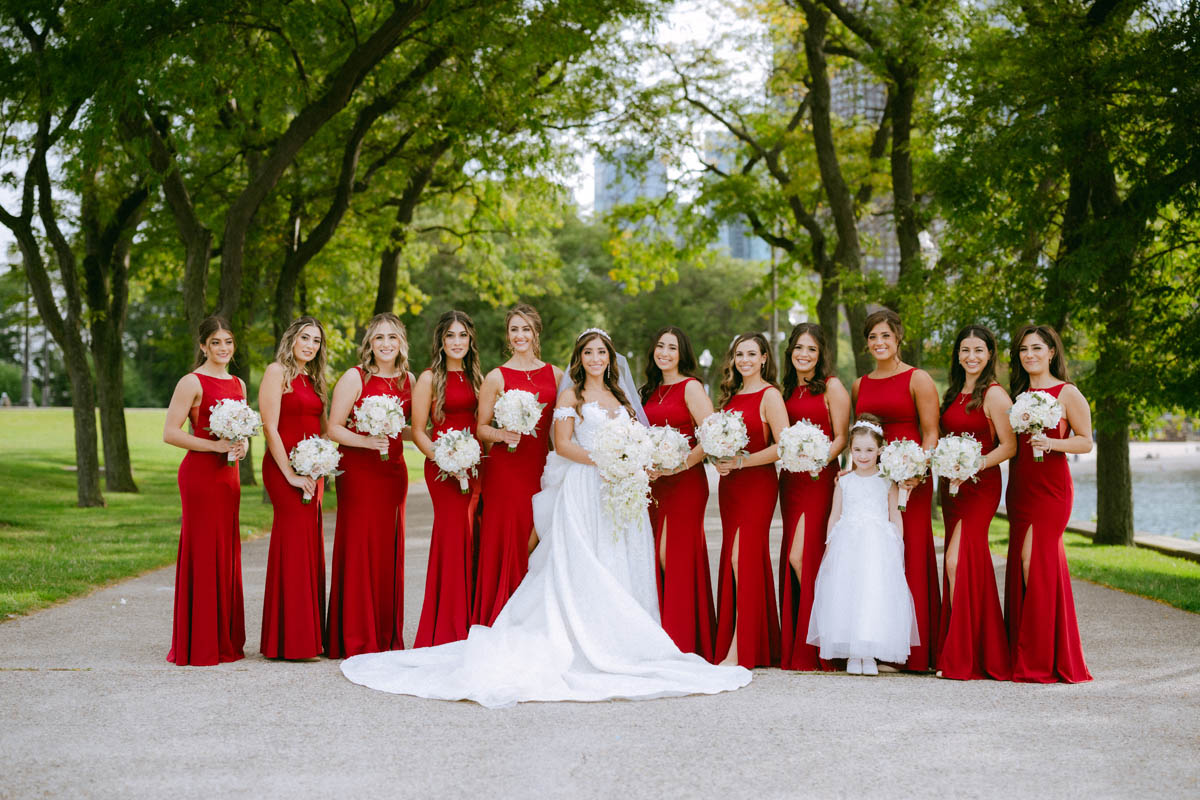 Greek wedding bridal party posing together at Olive Park