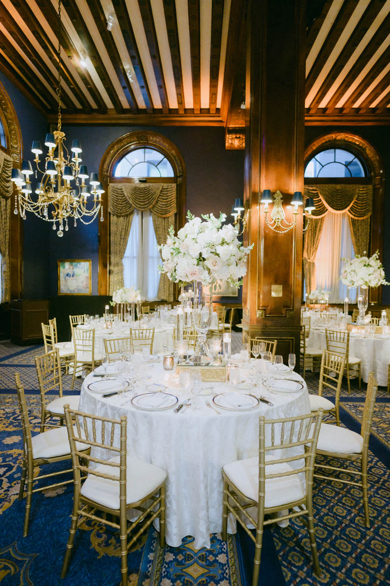 Elegant wedding reception tables decorated with white flowers at Union League Club