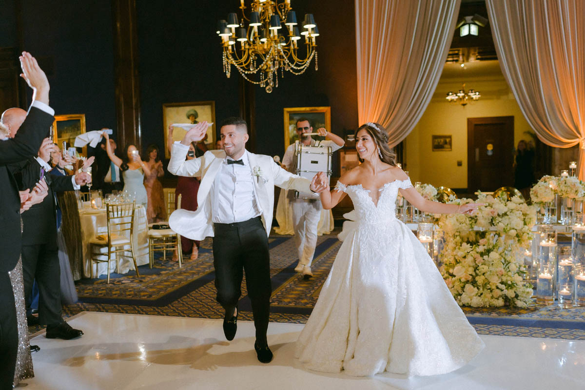 Bride and groom grand entrance with zaffe band