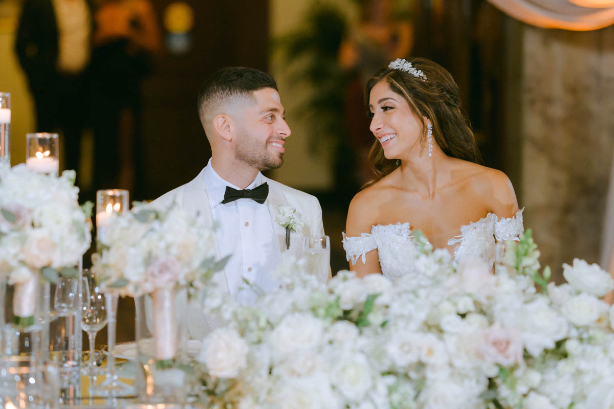 Bride and groom laughing together during their Chicago wedding reception