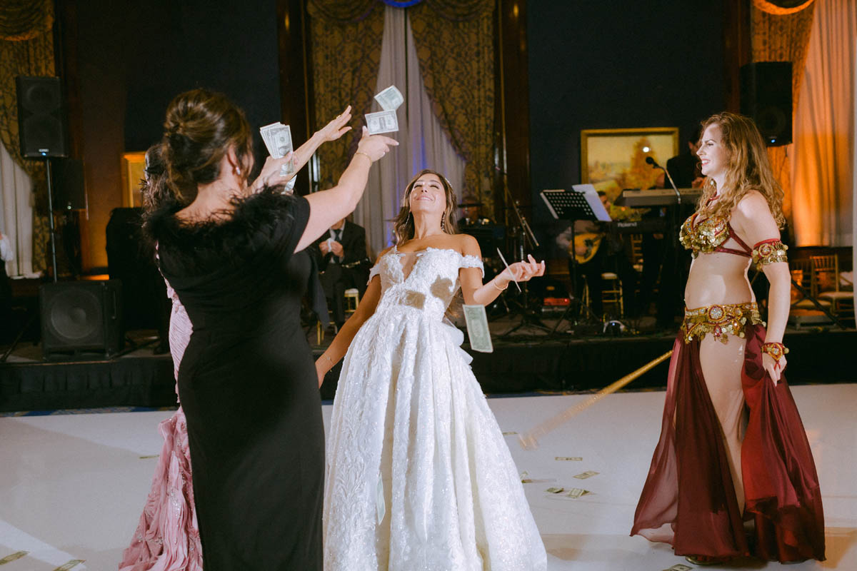 Bride dancing with guests during a Chicago Greek wedding