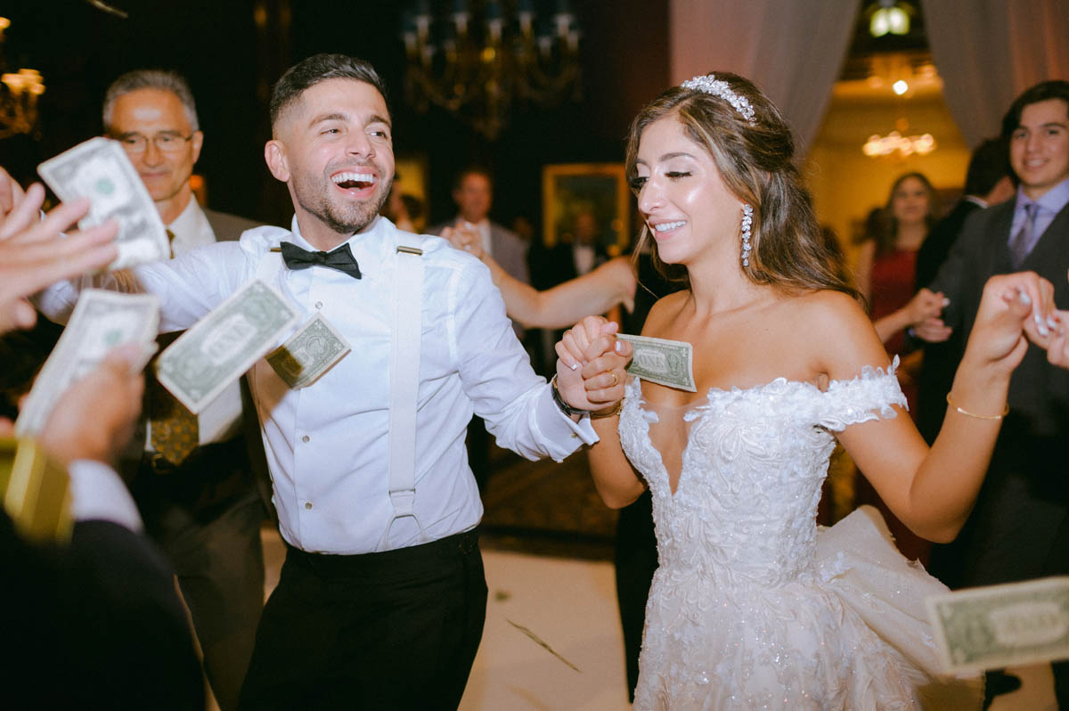 Bride and groom laughing together on the dance floor at their Chicago wedding