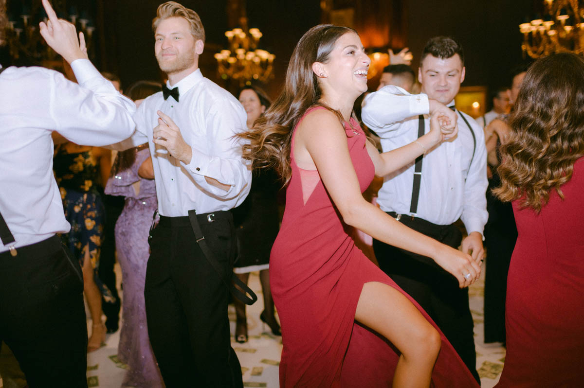 Bridesmaid dancing with guests at the Union League Club wedding reception