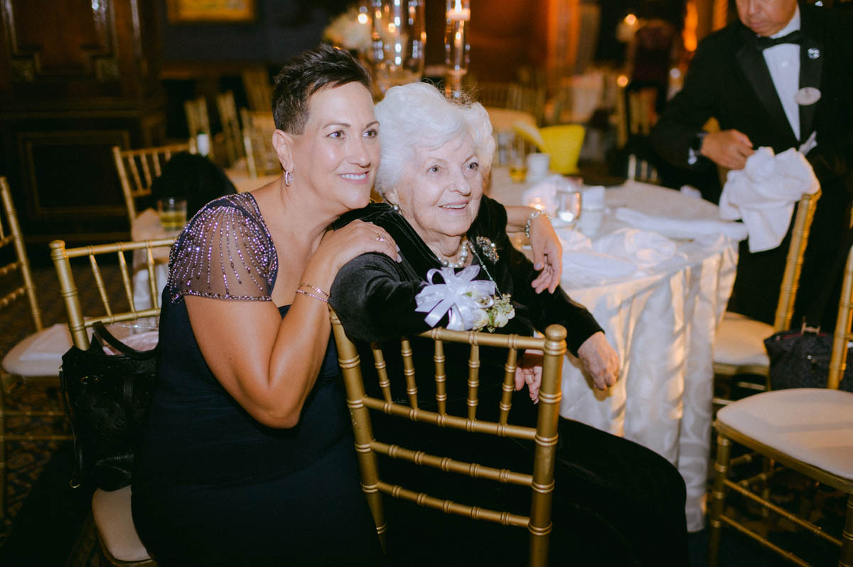 Guest laughing with grandmother during the reception