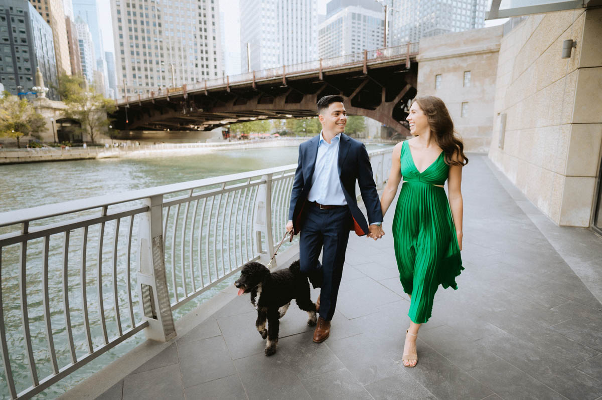 Chicago engagement photo of a couple walking together along the Chicago River
