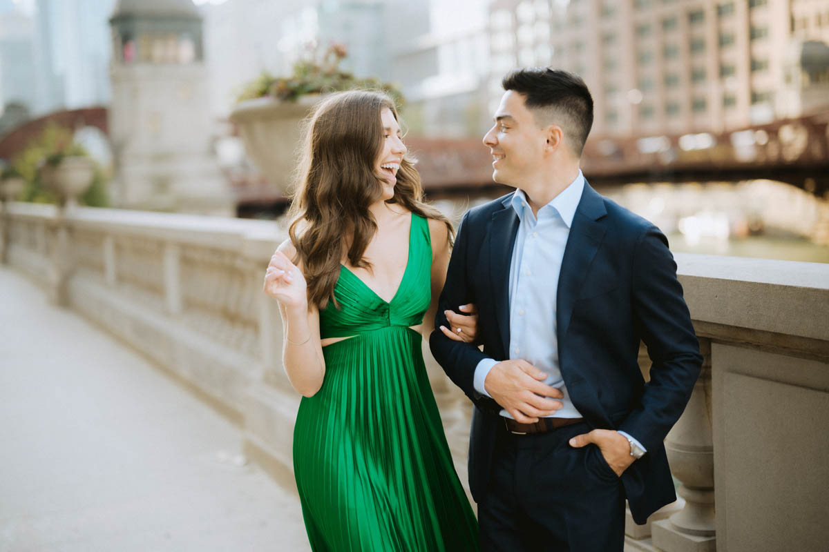 Chicago engagement photo of a couple laughing together along the Chicago River