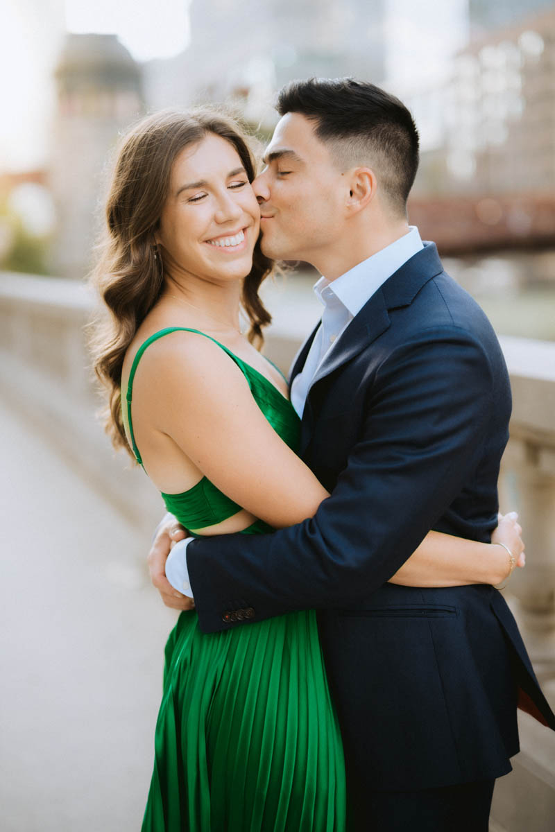 Romantic Chicago engagement portrait of a couple embracing along the Chicago River