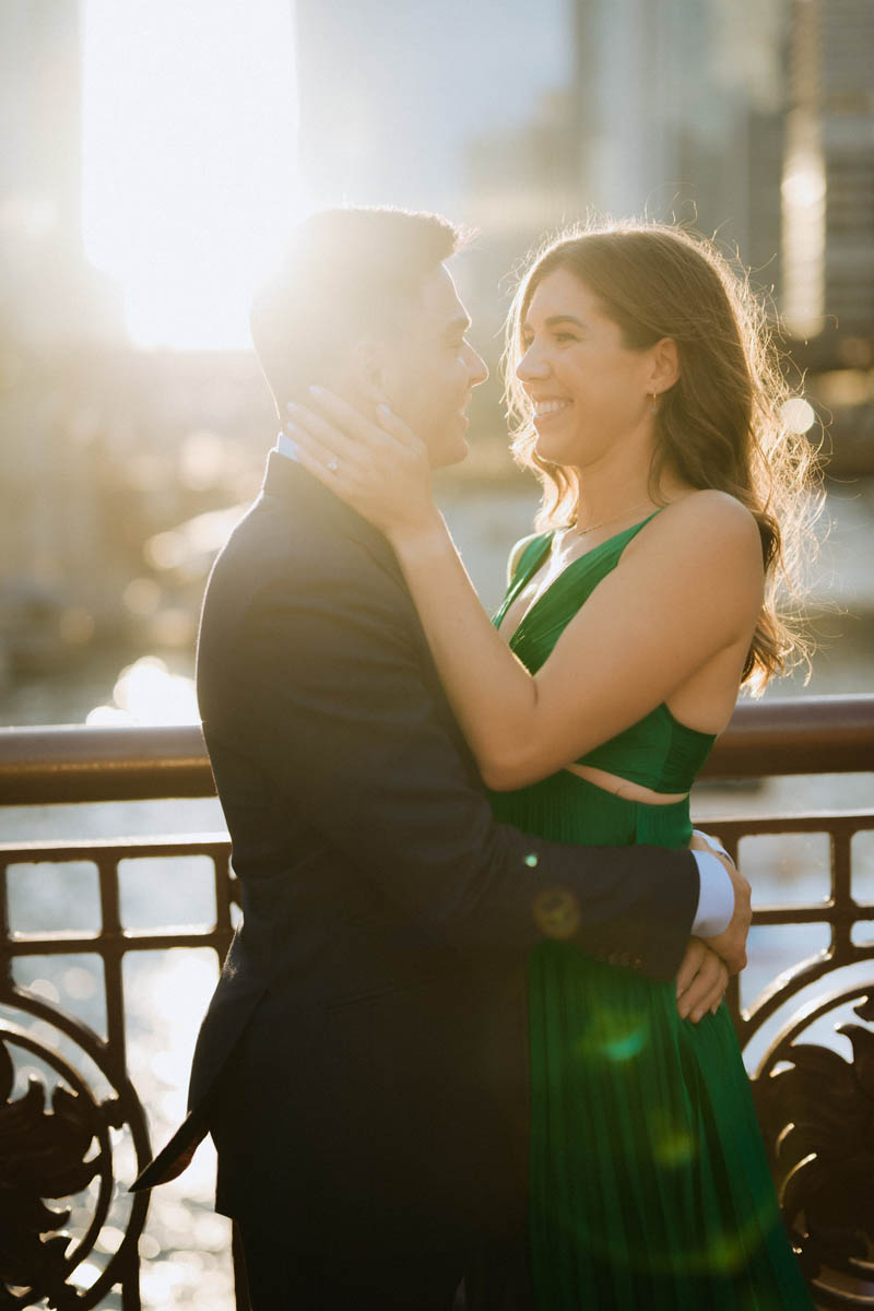 Romantic Chicago engagement photo of a couple embracing in warm evening light