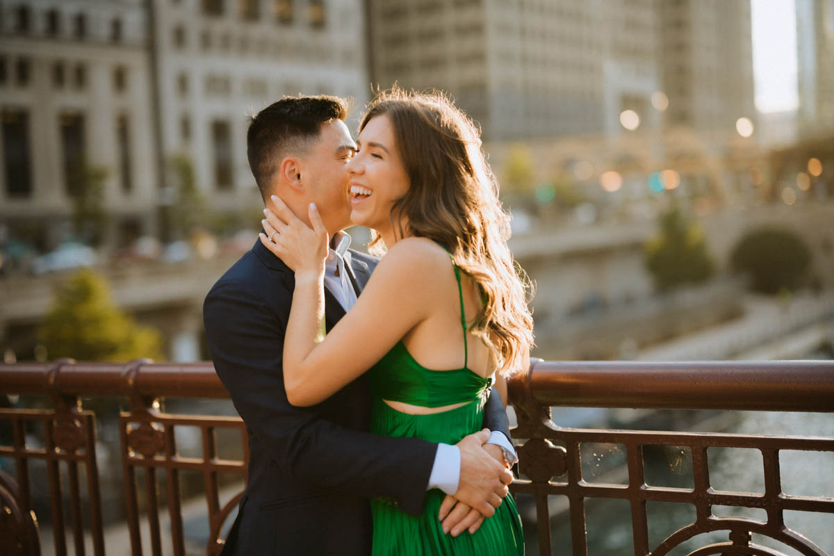 Romantic Chicago engagement photo of a couple embracing in warm evening light
