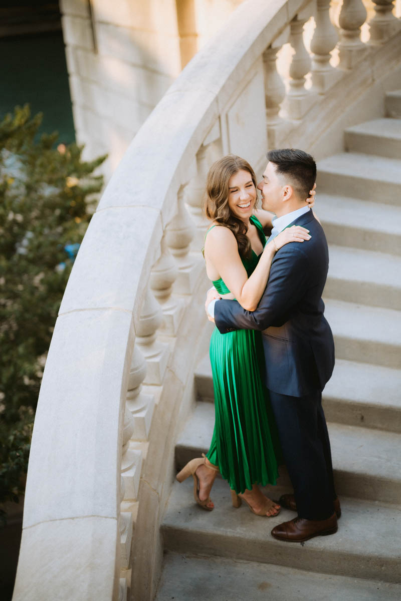 Chicago engagement photos of a couple walking along a grand downtown staircase