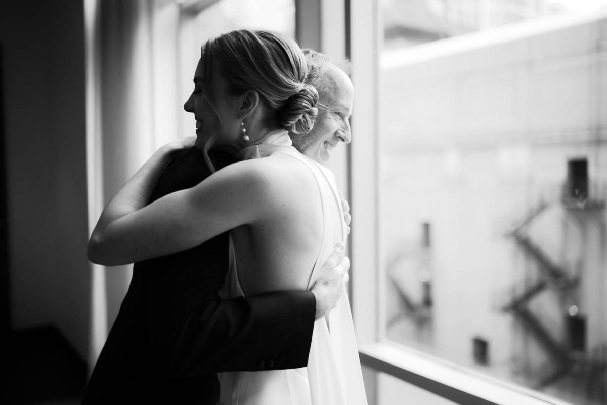 Bride and dad first look embracing at Wit Hotel wedding