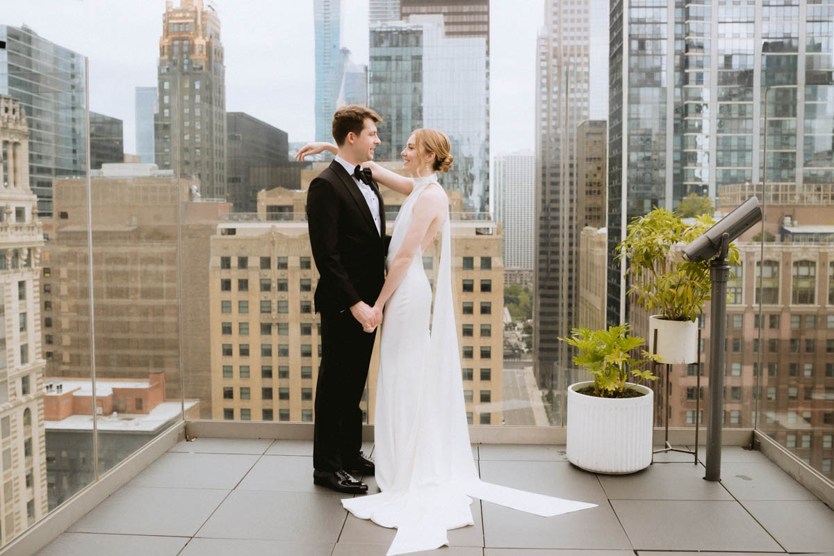 Bride and groom on the balcony of the Wit wedding