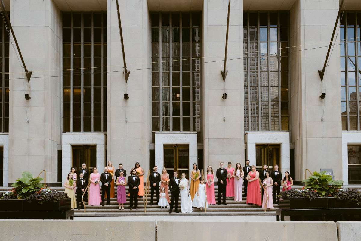 Wedding party standing on stairs at the Old Post Office Chicago