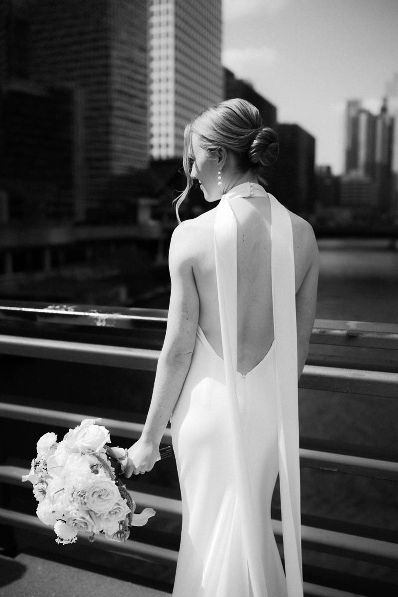 Cinematic black and white bride portrait on Chicago bridge
