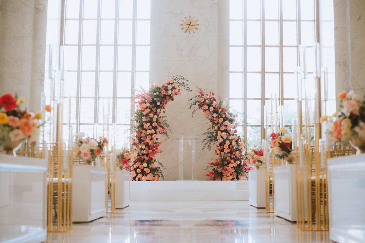 Floral wedding ceremony arch with white and pink flowers at the Old Post Office Chicago