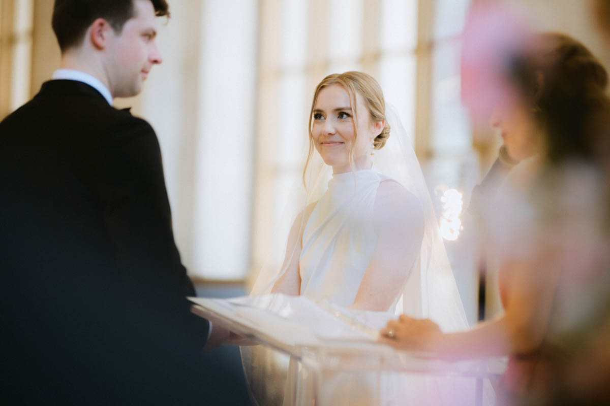 Bride smiling in a soft portrait during her wedding ceremony
