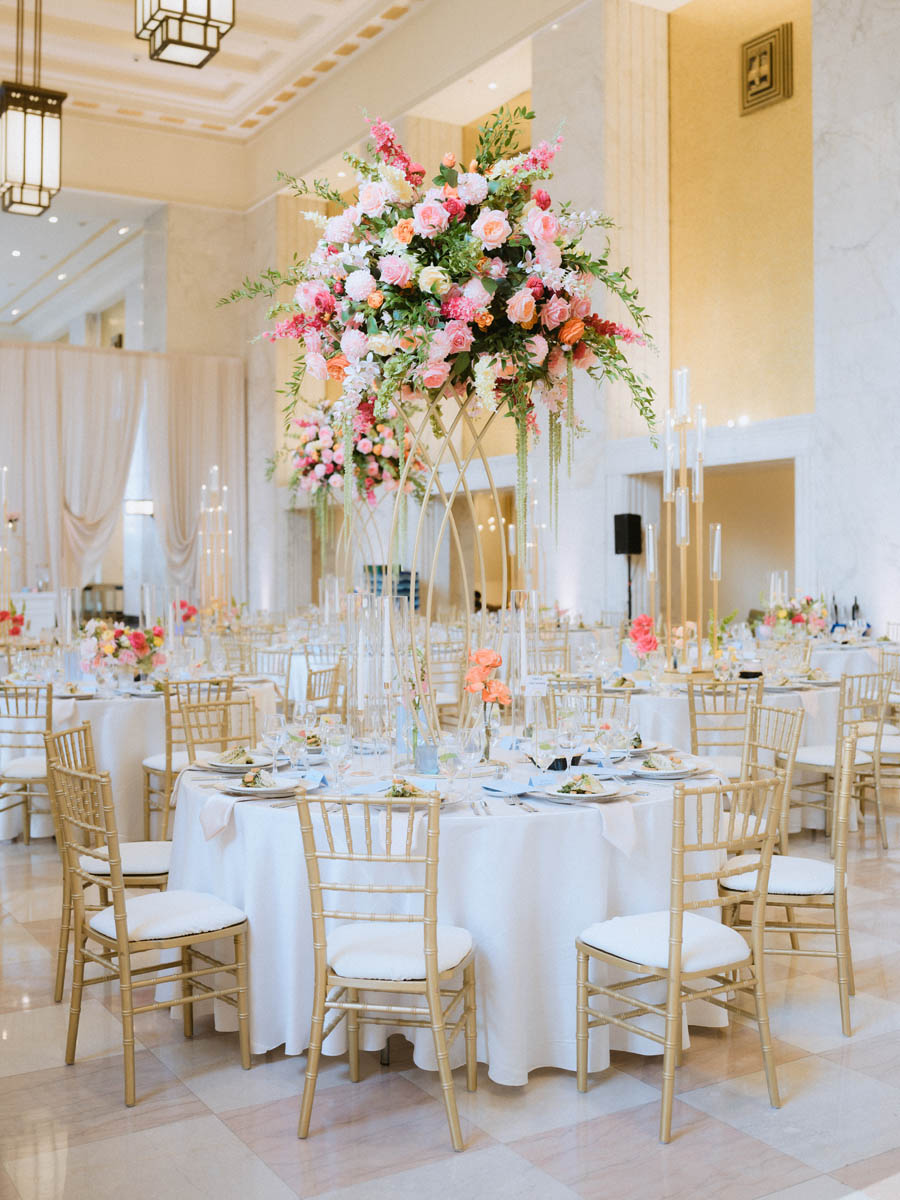 Elegant wedding reception table decorated with white florals and candles at the Old Post Office Chicago