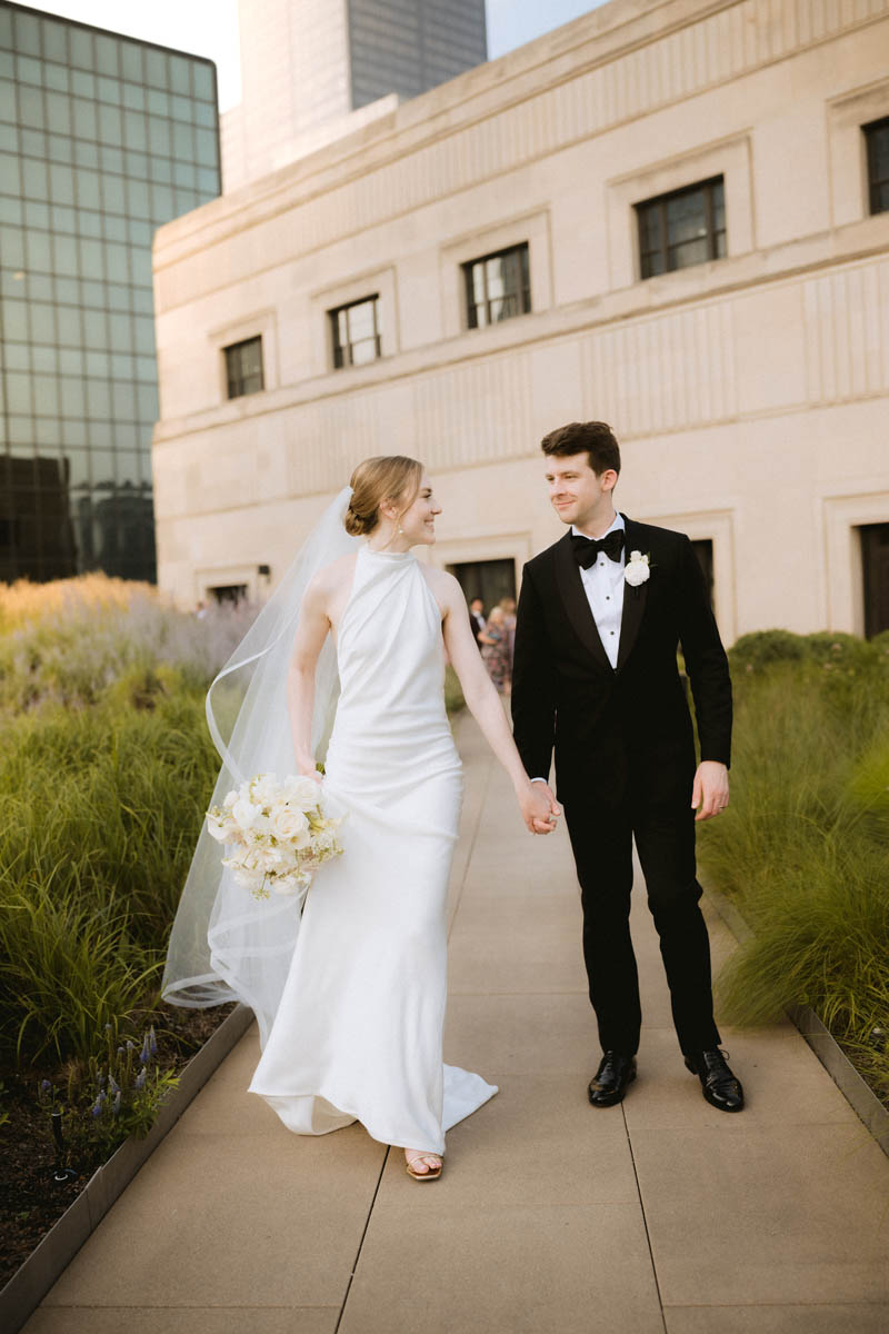 Bride and groom walking together on the rooftop of the Old Post Office Chicago