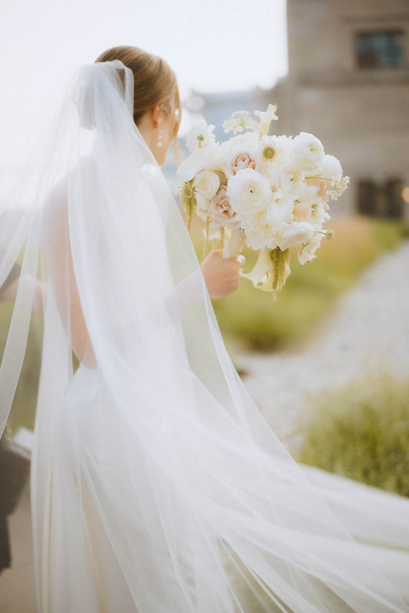 Close-up of bride holding her wedding bouquet on the Old Post Office Rooftop