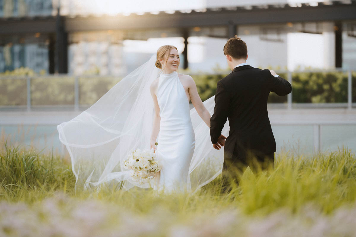 Bride and groom walking on the rooftop of the Old Post Office Chicago