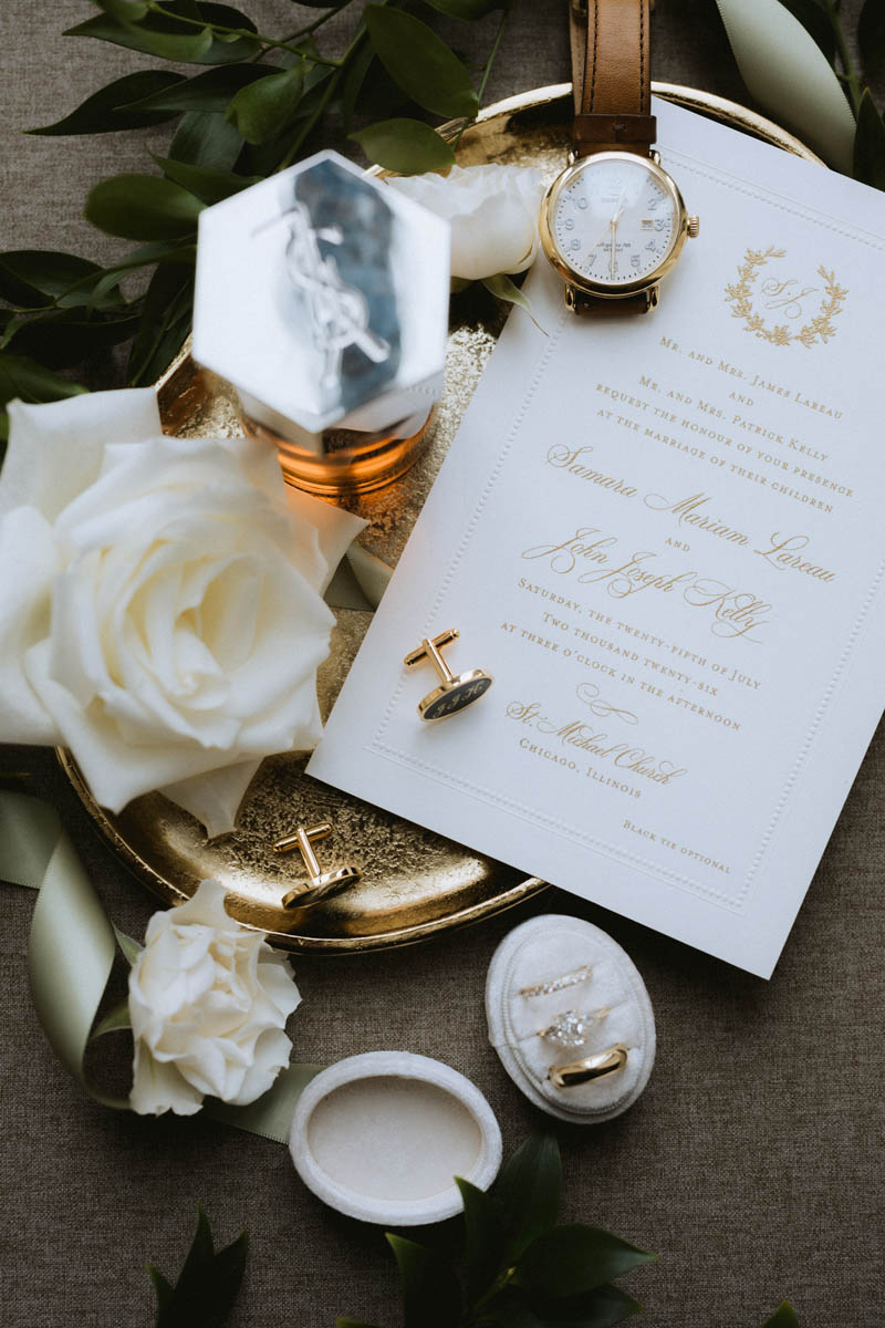 Wedding invitation, rings and floral details photographed at the Chicago Athletic Association Hotel in Chicago