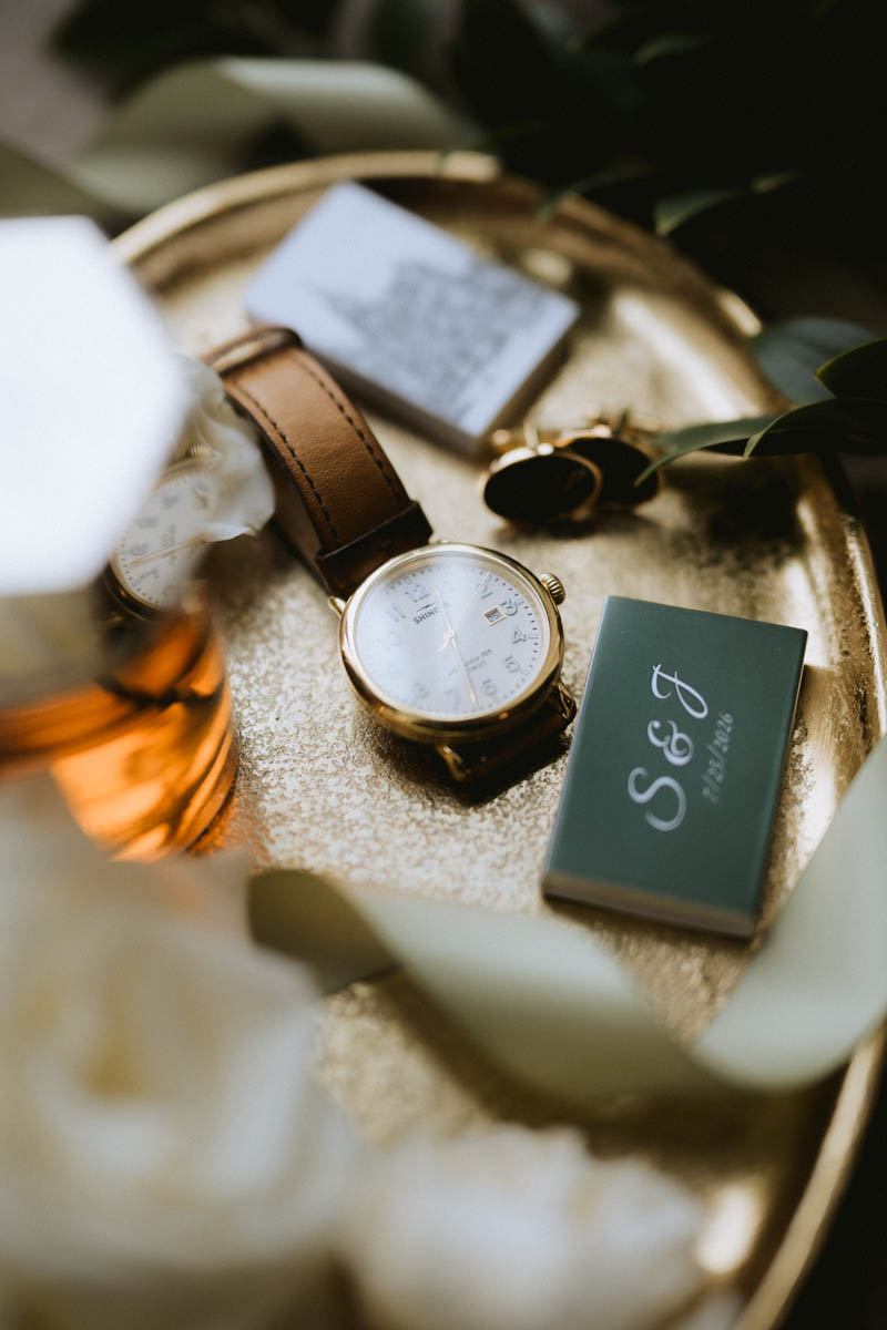 Wedding rings and personal wedding details photographed during bridal preparations at the Chicago Athletic Association Hotel