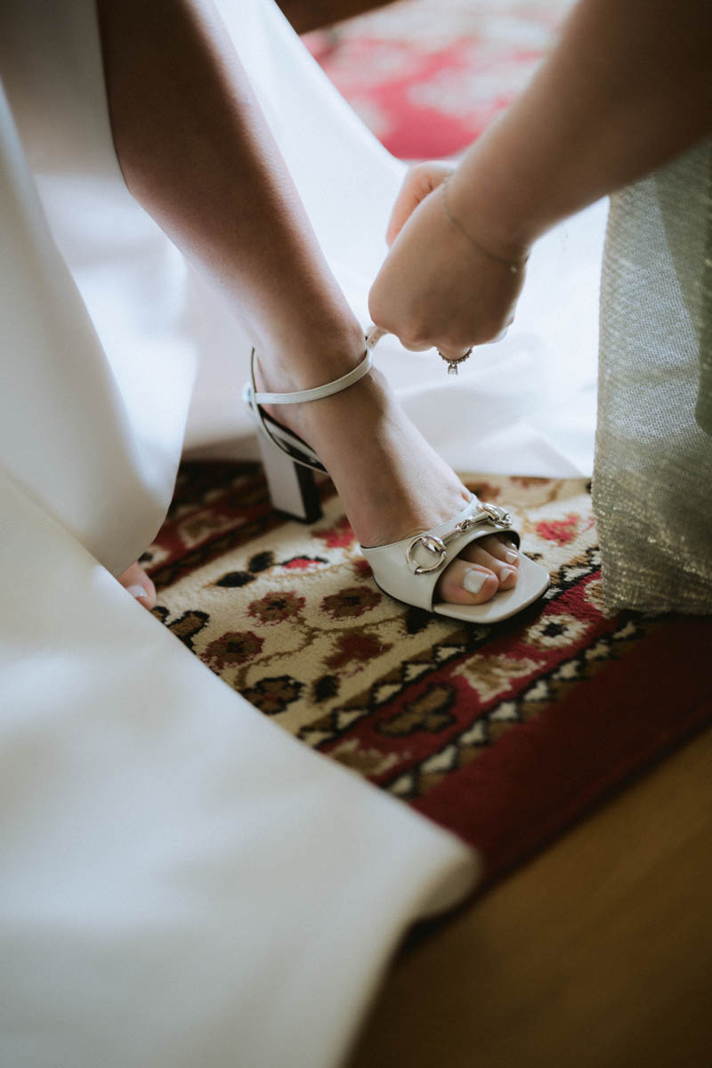 Closeup of white wedding shoes