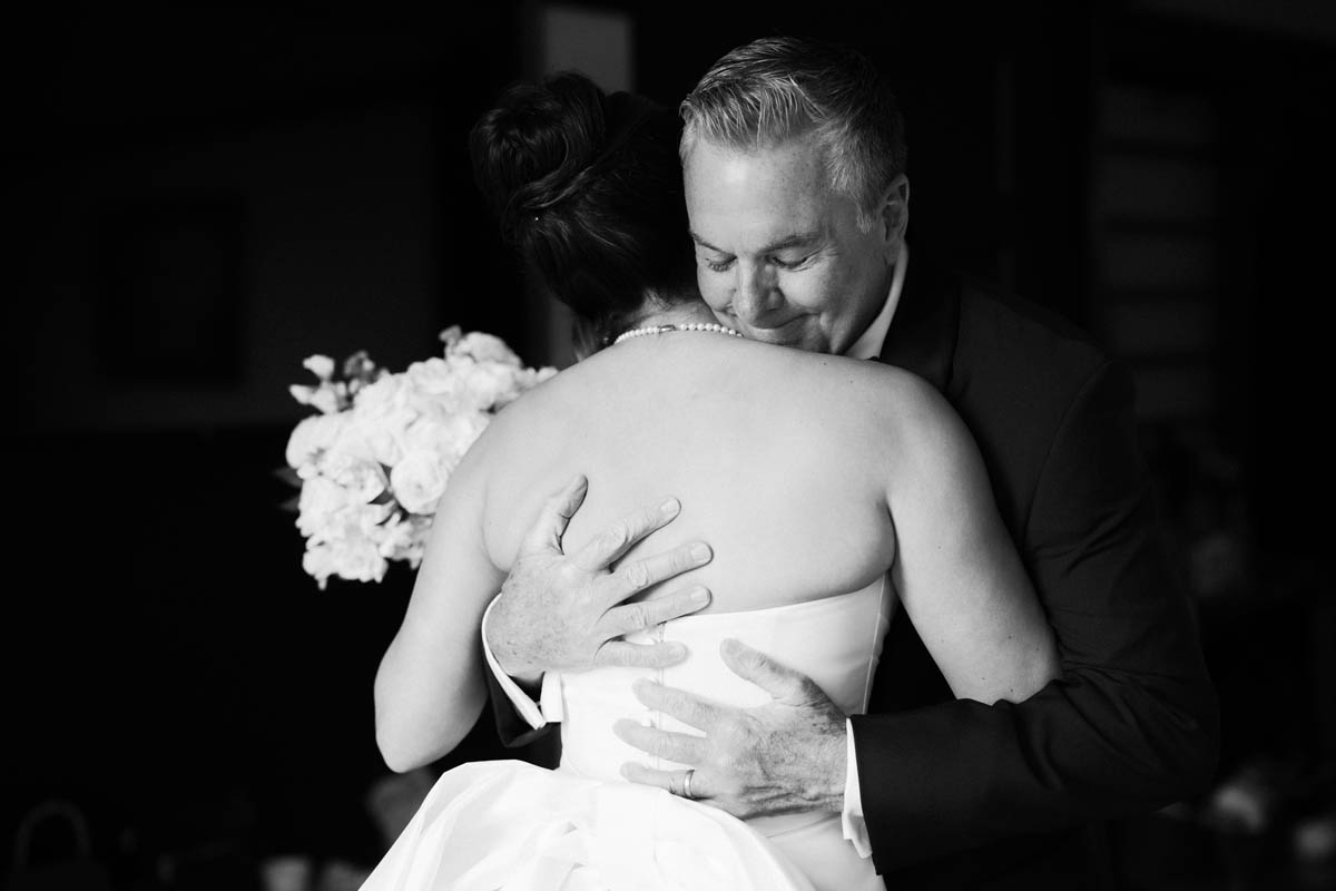 Bride and her dad sharing an emotional moment during wedding preparations