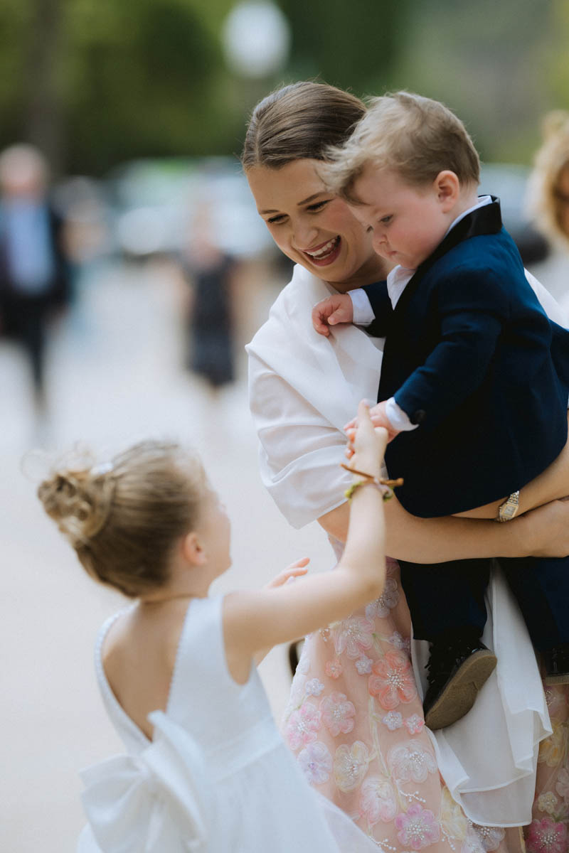 Wedding guests and kids arrive for the wedding ceremony