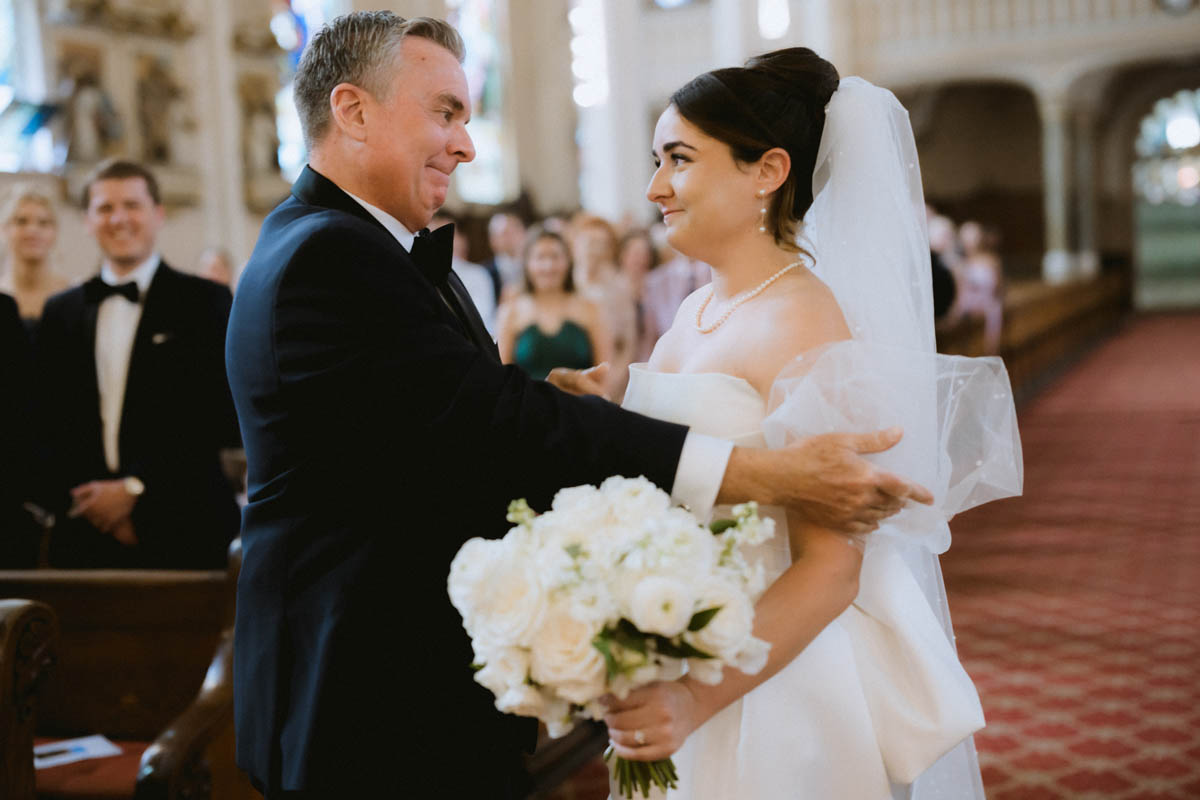 Bride's dad reacting emotionally during the wedding ceremony at St. Michael’s Church