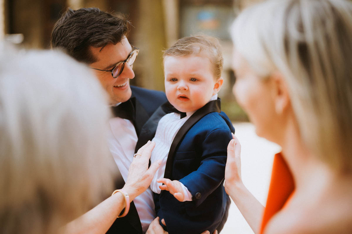Chubby little cheeks guest arriving at wedding ceremony