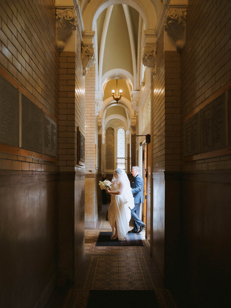 Bride and her dad walking into Church before the ceremony