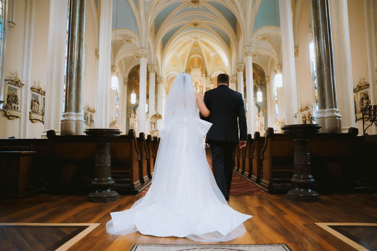Bride walking down the aisle with her dad