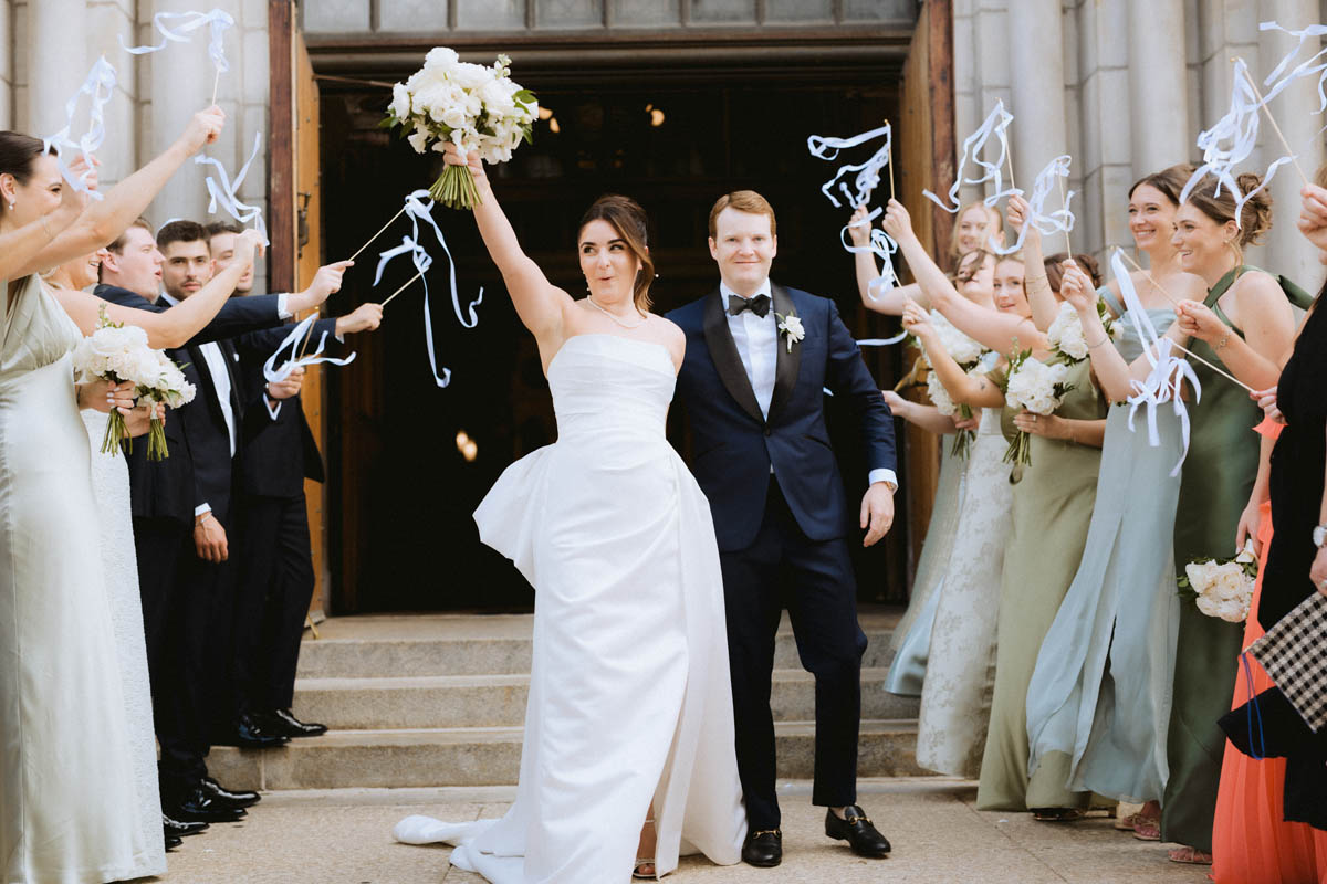 Bride and groom celebrate ceremony exit