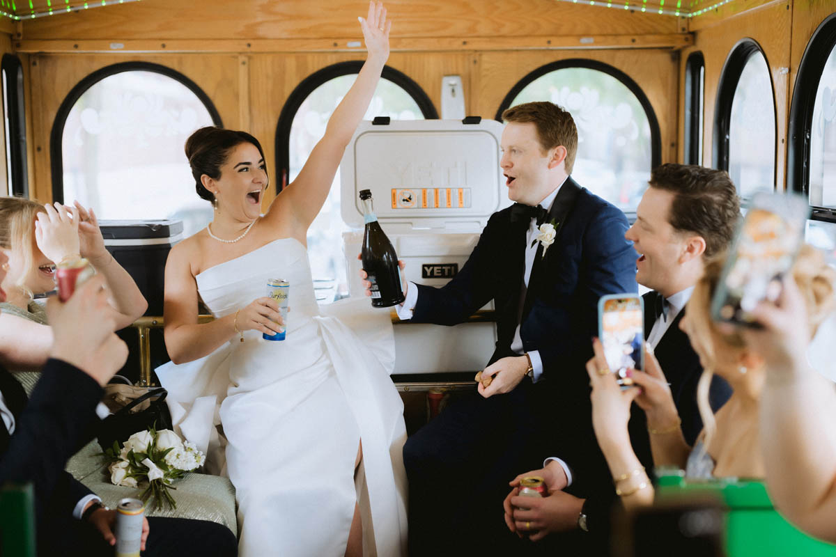 Bride and groom toast the champagne in the trolley